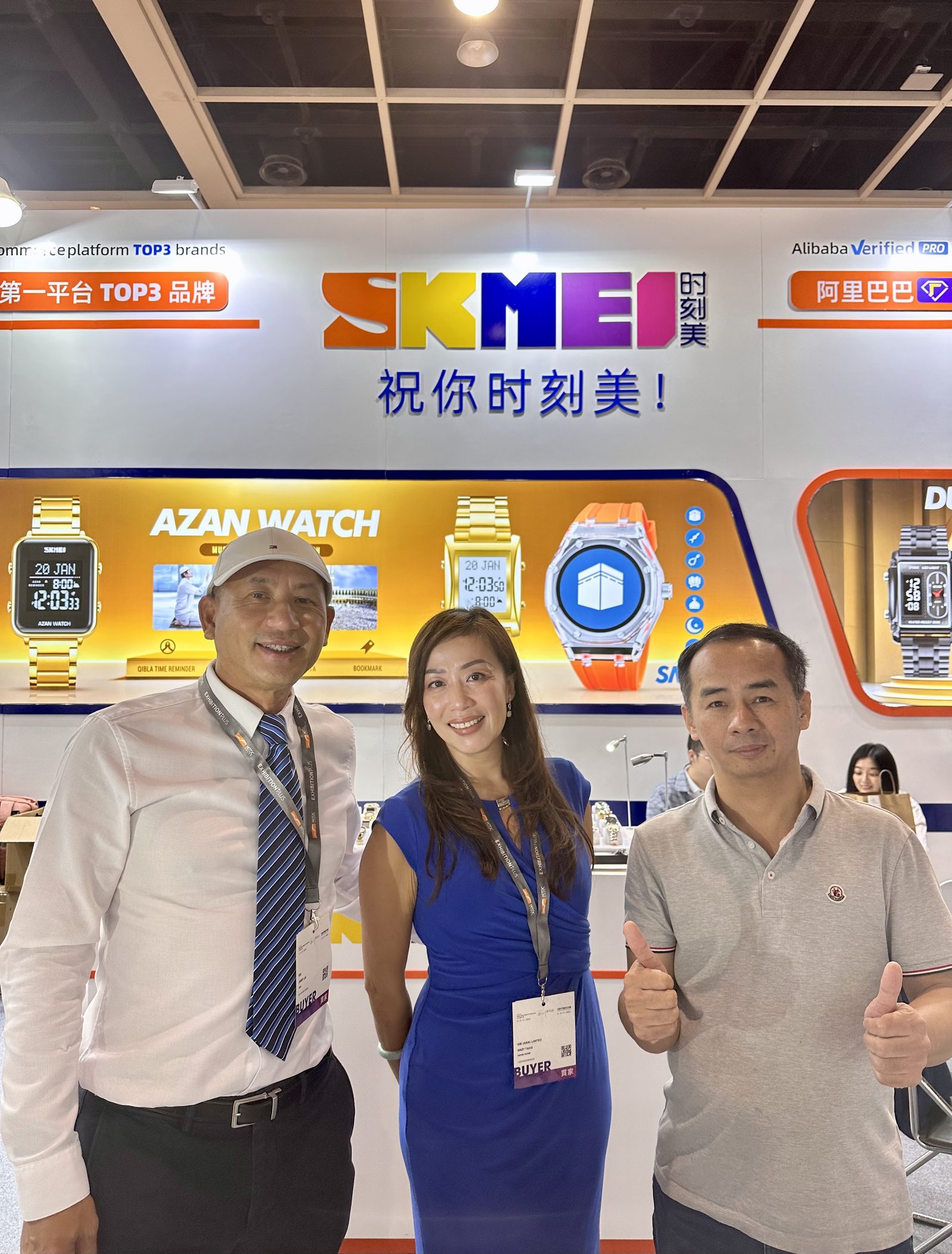 SKMEI representatives with partners in front of the AZAN Watch wall at the 2023 Hong Kong show