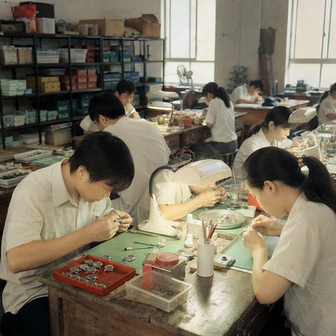 Scene illustration of a small watch assembly workshop in the 2000s